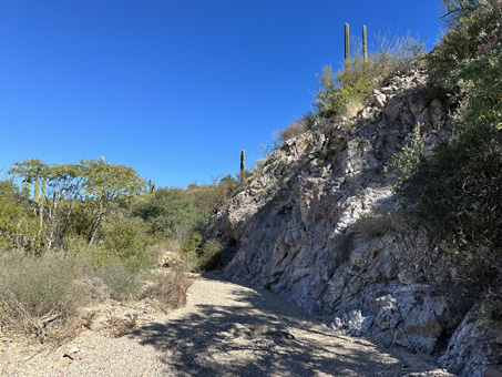 Arroyo and rocky outcrop